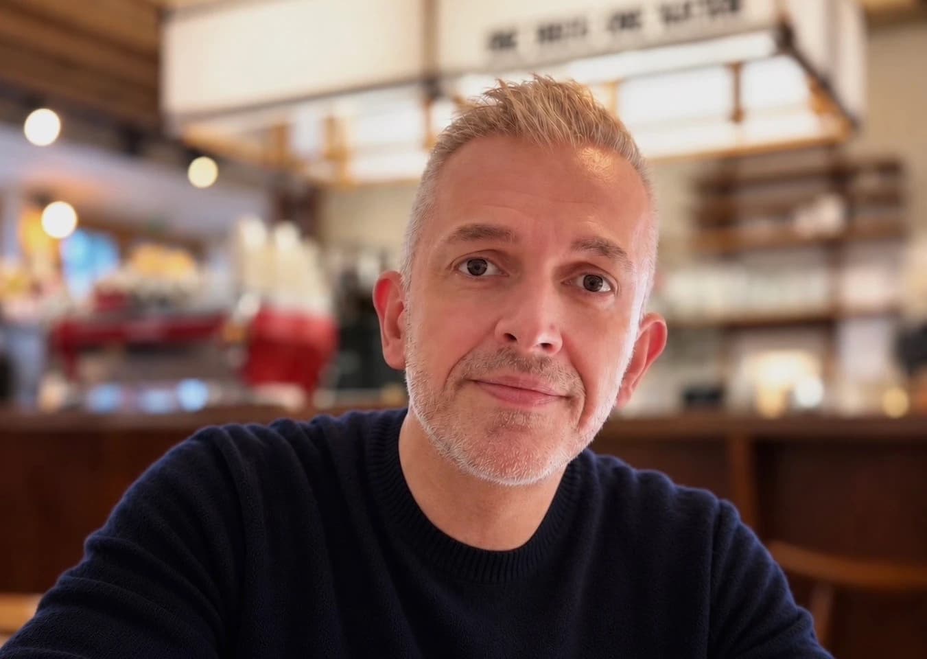 Laurent Lenders at a table in a coffee bar